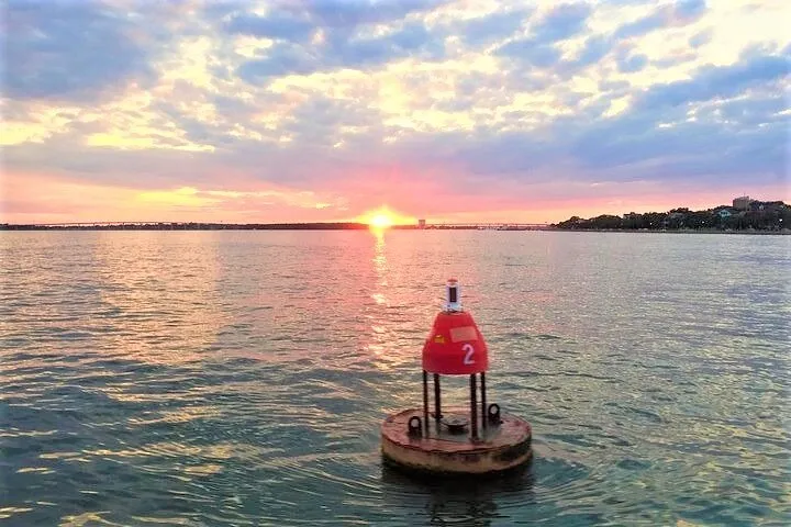 Sunset over the church steeples on a Charleston harbor cruise on a power catamaran, a sunset cruise from Charleston