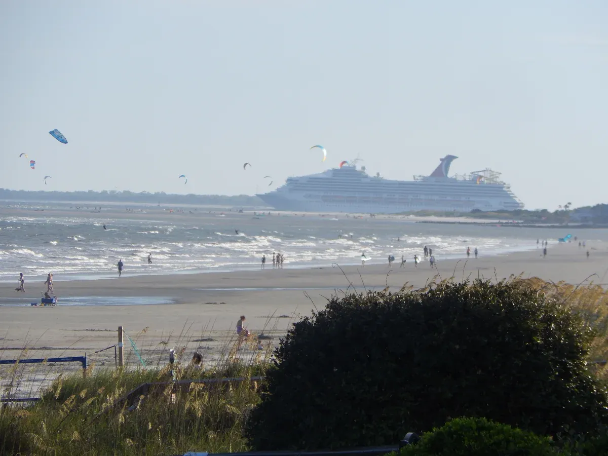 Carnival Sunshine cruise ship leaving Charleston Harbor on a cruise from the Charleston port