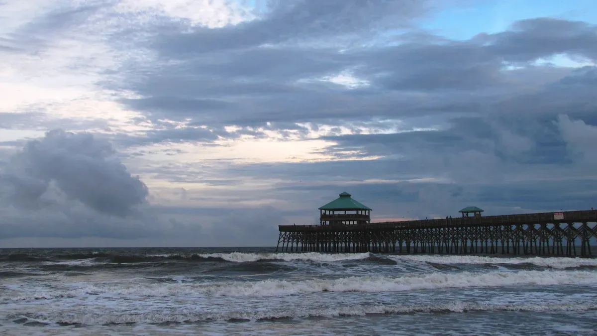 Folly Beach Pier over the surf near Charleston, home of the Folly Beach dolphin tour