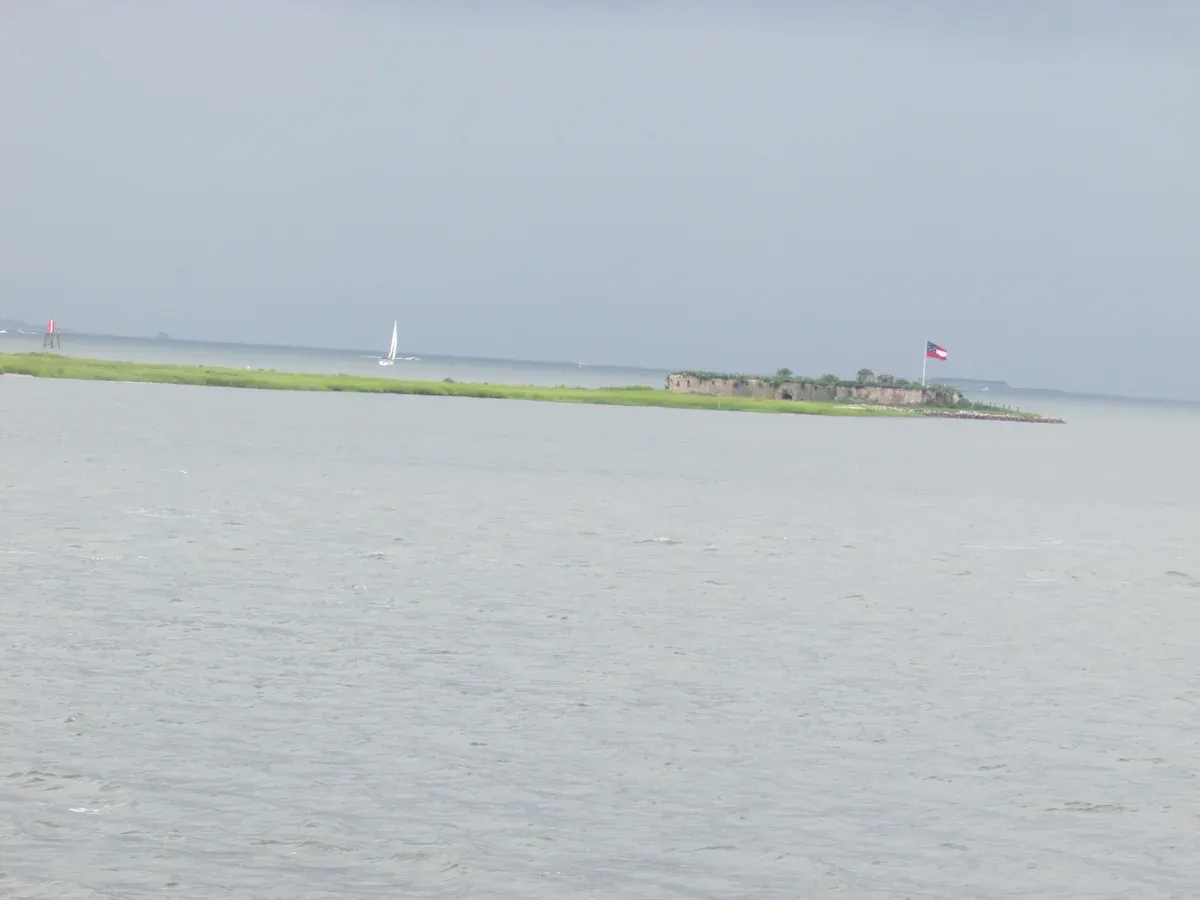 Distant view of Castle Pinckney, a 19th century fort on a small island seen on a Charleston harbor history cruise