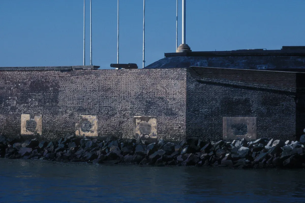 Brick walls and rock seawall of Fort Sumter in Charleston Harbor, seen on Charleston boat tours